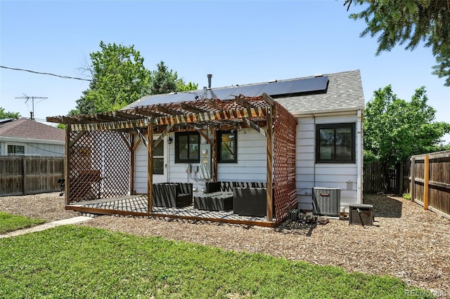1240 Ulster St, Denver, CO 80220 - rear view of house with solar panels, a pergola, a fenced backyard, and a patio