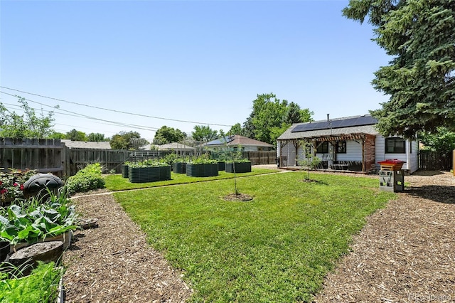 1240 Ulster St, Denver, CO 80220 - fenced backyard featuring a vegetable garden and a patio