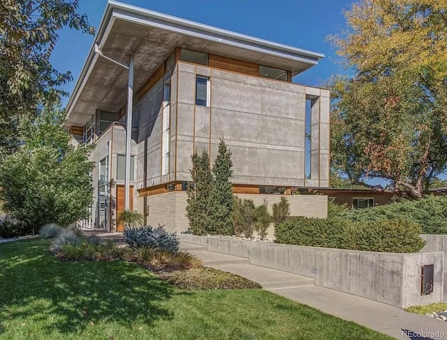 view of home's exterior featuring a lawn