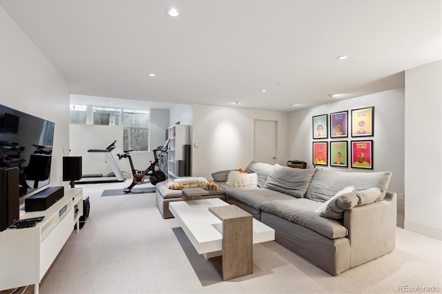 living room with light carpet and recessed lighting