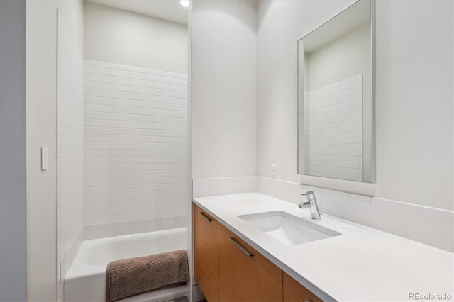 full bathroom featuring bathing tub / shower combination and vanity