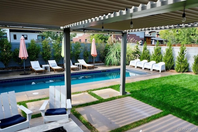 view of pool featuring a yard, a patio area, a fenced backyard, and a fenced in pool