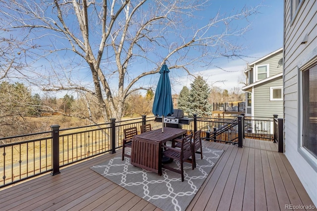 deck with outdoor dining area