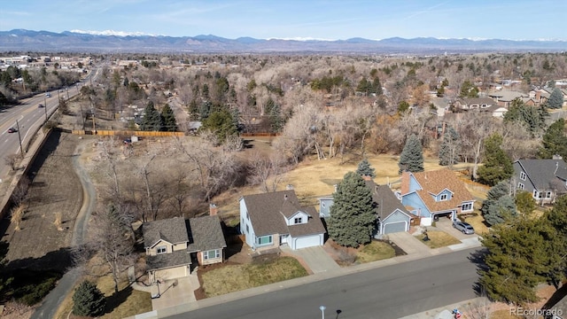 drone / aerial view with a residential view and a mountain view