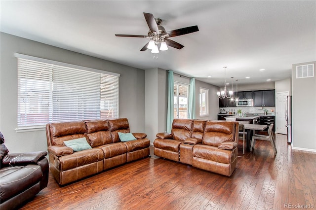 25046 E Bayaud Pl, Aurora, CO 80018 - living area with dark wood-style floors, ceiling fan, and recessed lighting