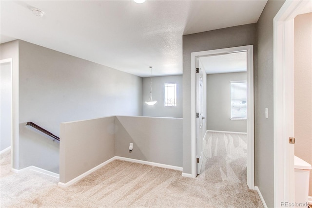 25046 E Bayaud Pl, Aurora, CO 80018 - hall with an upstairs landing, carpet, and baseboards