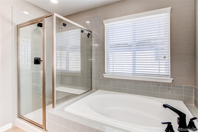 25046 E Bayaud Pl, Aurora, CO 80018 - full bathroom featuring a stall shower, a garden tub, and recessed lighting