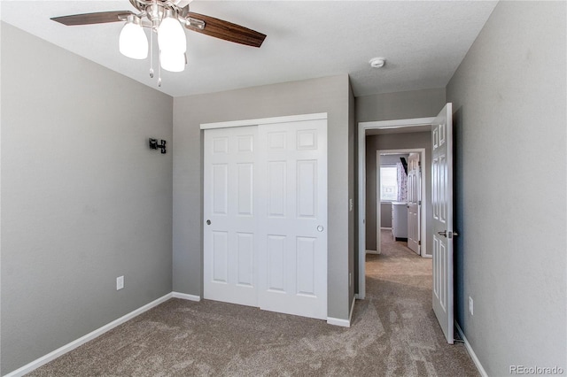 25046 E Bayaud Pl, Aurora, CO 80018 - unfurnished bedroom with carpet, a closet, baseboards, and ceiling fan