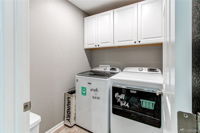 25046 E Bayaud Pl, Aurora, CO 80018 - laundry area with washing machine and clothes dryer, cabinet space, and a textured wall