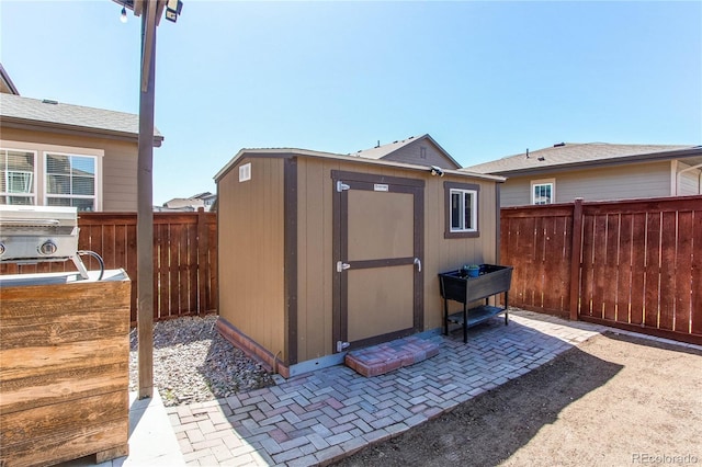25046 E Bayaud Pl, Aurora, CO 80018 - view of shed featuring a fenced backyard