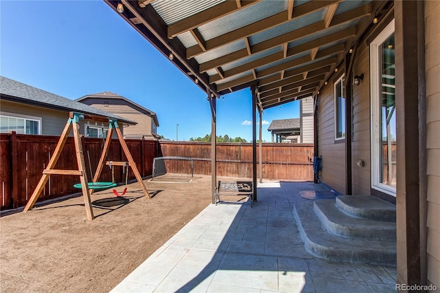 25046 E Bayaud Pl, Aurora, CO 80018 - view of patio / terrace featuring a fenced backyard and a playground