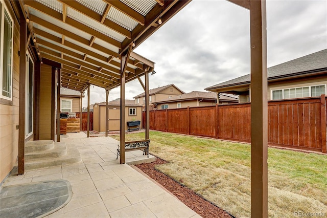 25046 E Bayaud Pl, Aurora, CO 80018 - fenced backyard featuring a patio, a shed, and entry steps
