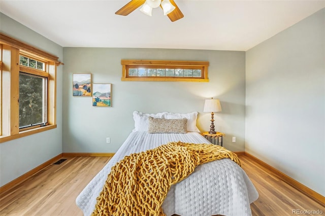 bedroom featuring ceiling fan and light hardwood / wood-style flooring