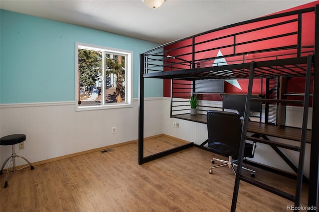 bedroom featuring hardwood / wood-style flooring