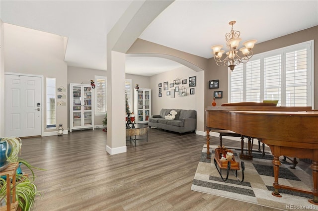 interior space featuring a chandelier and dark hardwood / wood-style flooring