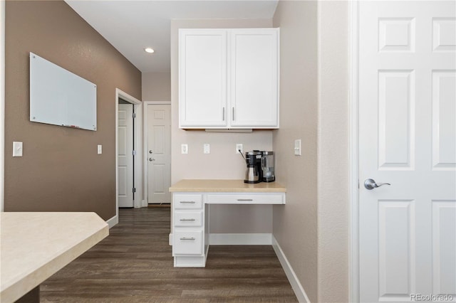 kitchen featuring white cabinets and dark hardwood / wood-style floors