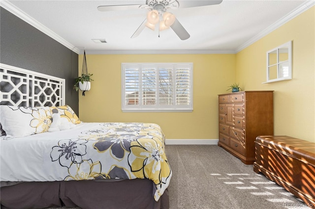 carpeted bedroom with ceiling fan and crown molding