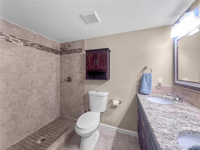 7085 Kiowa Rd, Larkspur, CO 80118 - bathroom featuring double vanity, tiled shower, and tile patterned flooring
