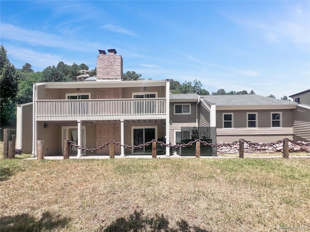 7085 Kiowa Rd, Larkspur, CO 80118 - back of property featuring a chimney and a yard
