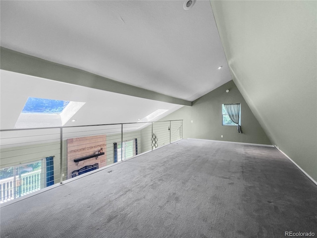 7085 Kiowa Rd, Larkspur, CO 80118 - additional living space with a skylight, lofted ceiling, and carpet flooring
