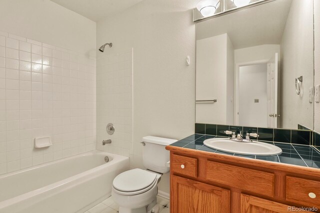 3244 Capstan Way, Colorado Springs, CO 80906 - full bathroom with tile patterned flooring, vanity, tiled shower / bath, and toilet