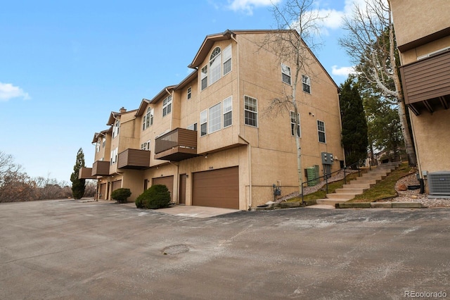 3244 Capstan Way, Colorado Springs, CO 80906 - view of property featuring a garage and central AC