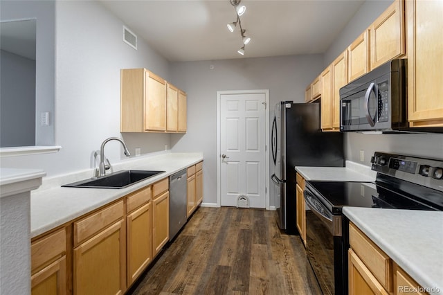 4451 S Ammons St Unit 2-204, Littleton, CO 80123 - kitchen with range with electric stovetop, black microwave, dishwasher, and light brown cabinetry