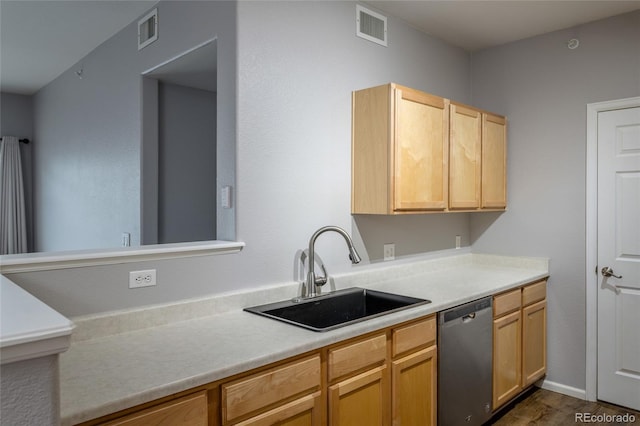 4451 S Ammons St Unit 2-204, Littleton, CO 80123 - kitchen featuring dishwasher, light countertops, dark wood finished floors, and light brown cabinetry