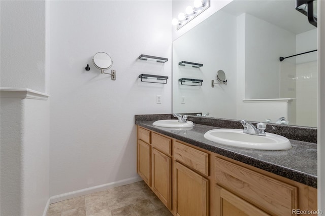 4451 S Ammons St Unit 2-204, Littleton, CO 80123 - full bathroom with double vanity and a shower
