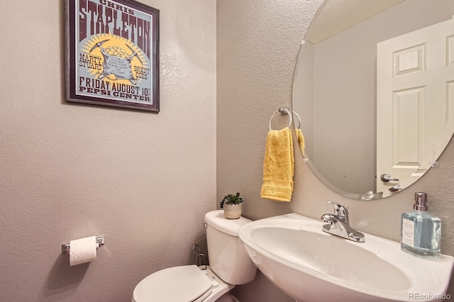 9381 Ashbury Cir Unit 105, Parker, CO 80134 - half bathroom with a sink and a textured wall