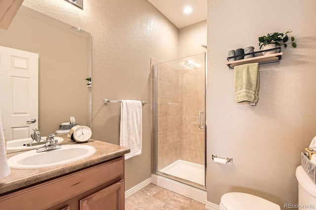 9381 Ashbury Cir Unit 105, Parker, CO 80134 - bathroom with a shower stall, vanity, and tile patterned flooring