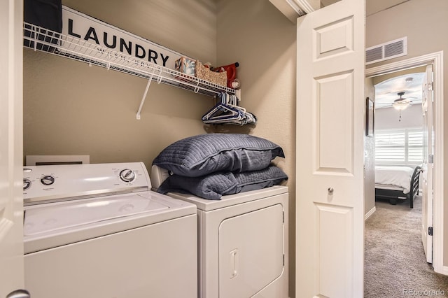 9381 Ashbury Cir Unit 105, Parker, CO 80134 - washroom featuring washer and clothes dryer, carpet floors, and a ceiling fan
