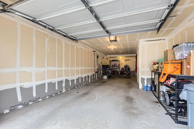 9381 Ashbury Cir Unit 105, Parker, CO 80134 - garage featuring a garage door opener