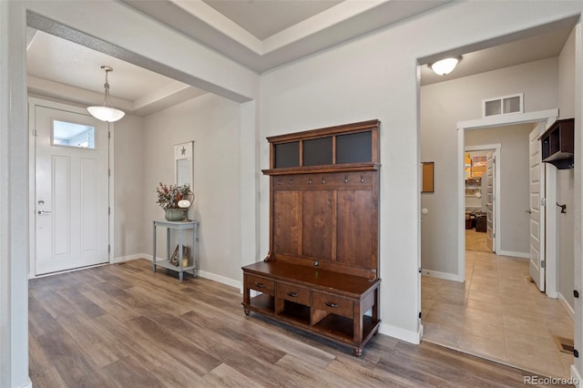 2200 Cadman St, Berthoud, CO 80513 - entrance foyer with a raised ceiling, baseboards, and wood finished floors