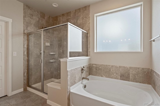 2200 Cadman St, Berthoud, CO 80513 - bathroom featuring a bath, a stall shower, and tile patterned floors