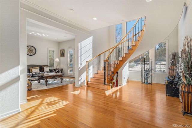 entryway with hardwood / wood-style floors