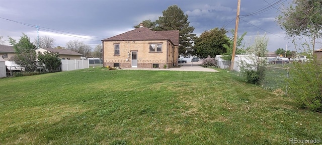 9120 Elm Ct, Denver, CO 80260 - rear view of property featuring brick siding and a patio