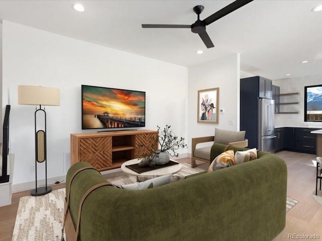 living room featuring light wood-style floors, recessed lighting, and ceiling fan