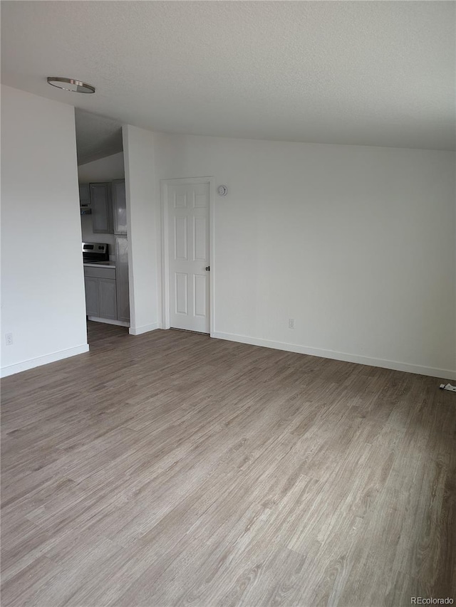 7486 Harold St, Fort Lupton, CO 80621 - spare room featuring wood finished floors and baseboards