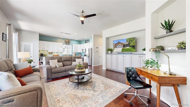 living room featuring ceiling fan, dark wood-type flooring, and recessed lighting