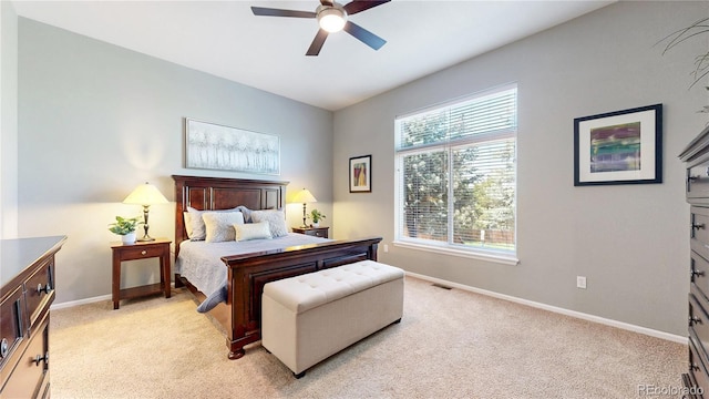 bedroom with baseboards, light carpet, and ceiling fan