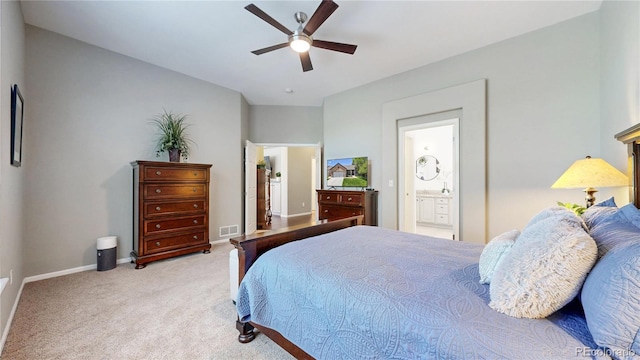 bedroom with carpet floors, baseboards, ensuite bath, and ceiling fan