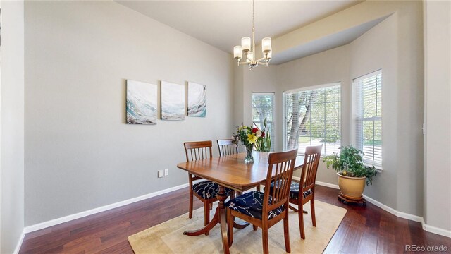 20855 Omaha Ave, Parker, CO 80138 - dining area with a chandelier, wood finished floors, and baseboards