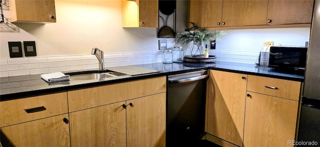 kitchen featuring tasteful backsplash, dishwasher, and sink