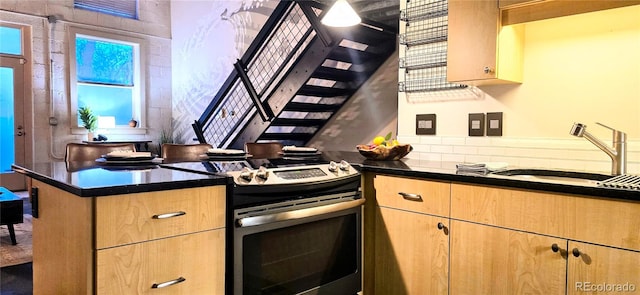 kitchen with sink and stainless steel range with electric stovetop