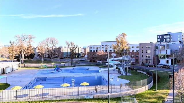 view of community with a patio area and a swimming pool