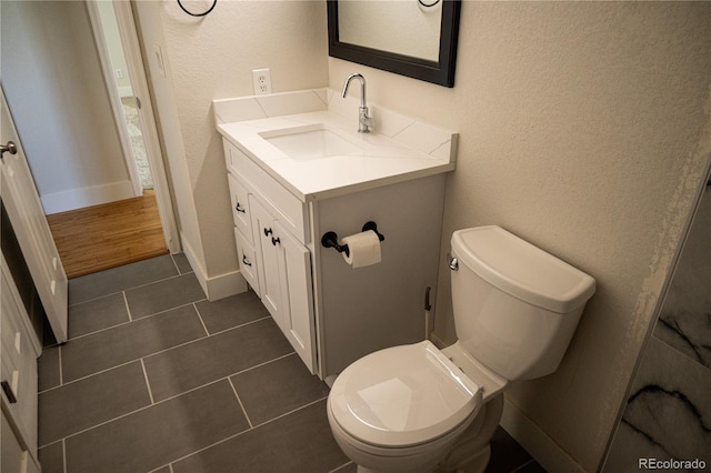 38810 Jacobson Rd, Rush, CO 80833 - half bathroom featuring vanity, a textured wall, and tile patterned flooring