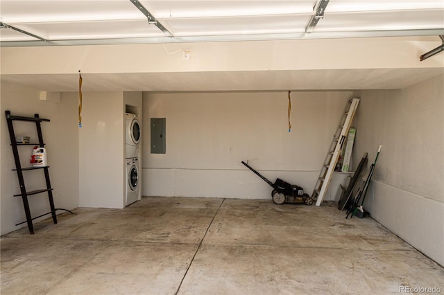 38810 Jacobson Rd, Rush, CO 80833 - garage featuring stacked washer and clothes dryer and electric panel