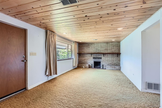 unfurnished living room with visible vents, carpet, a fireplace, and wood ceiling