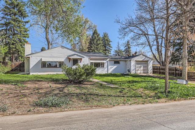 ranch-style home with an attached garage, stucco siding, fence, and a chimney